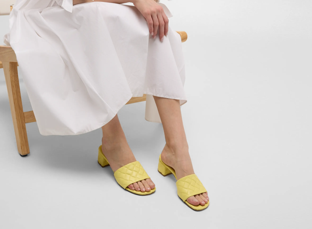 A pair of retro-inspired platform slippers in vibrant colors, combining vintage aesthetics with modern comfort for Spring/Summer 2024.A pair of retro-inspired platform slippers in vibrant colors, combining vintage aesthetics with modern comfort for Spring/Summer 2024.